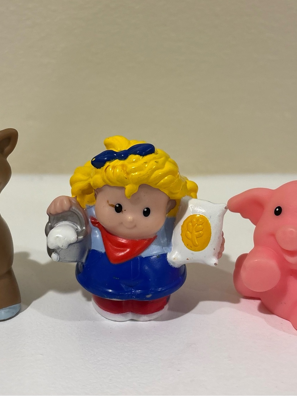 Fisher-Price Blue and Yellow Girl Figurine with Red Scarf